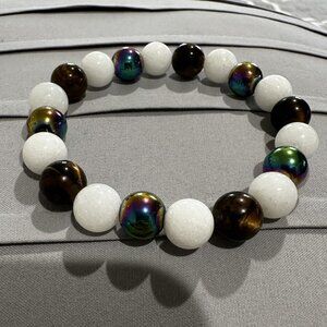 This is for @al_vanamburgh only 10mm Tiger Eye, White Tridacna, and Rainbow Hem